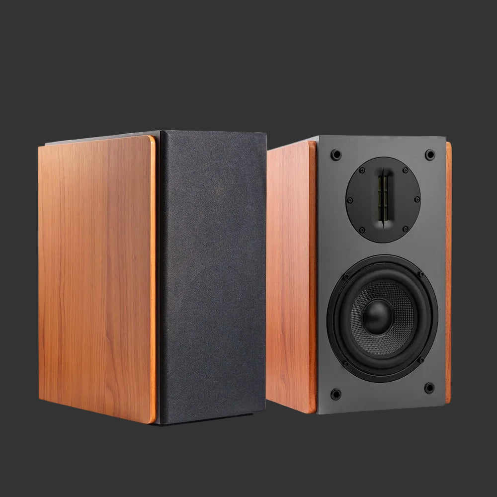 Pair of wooden bookshelf speakers on a white background